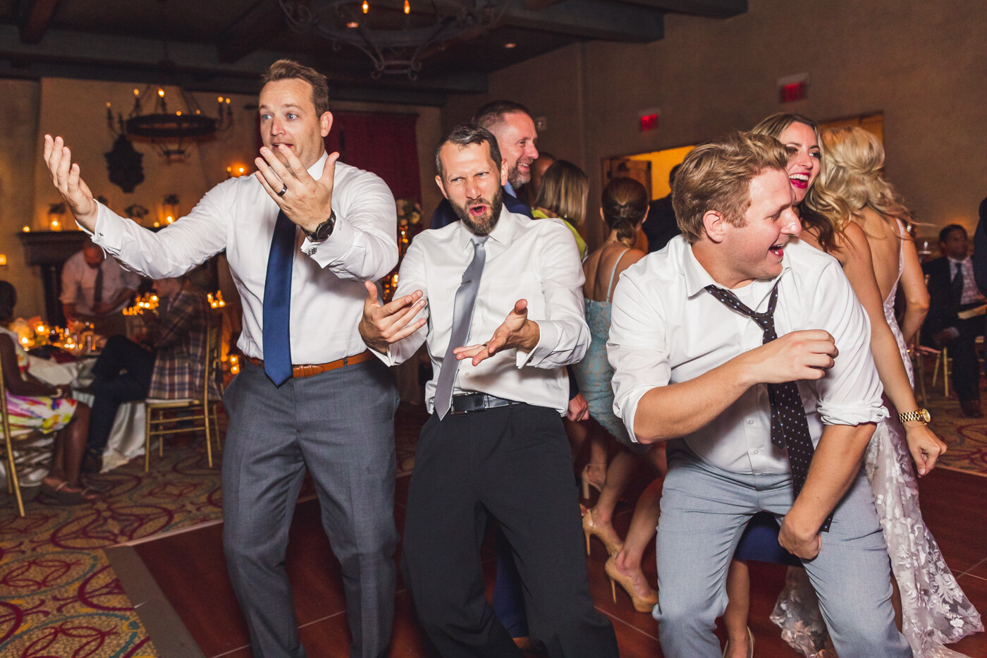 groom-and-guests-having-fun-at-reception.jpg