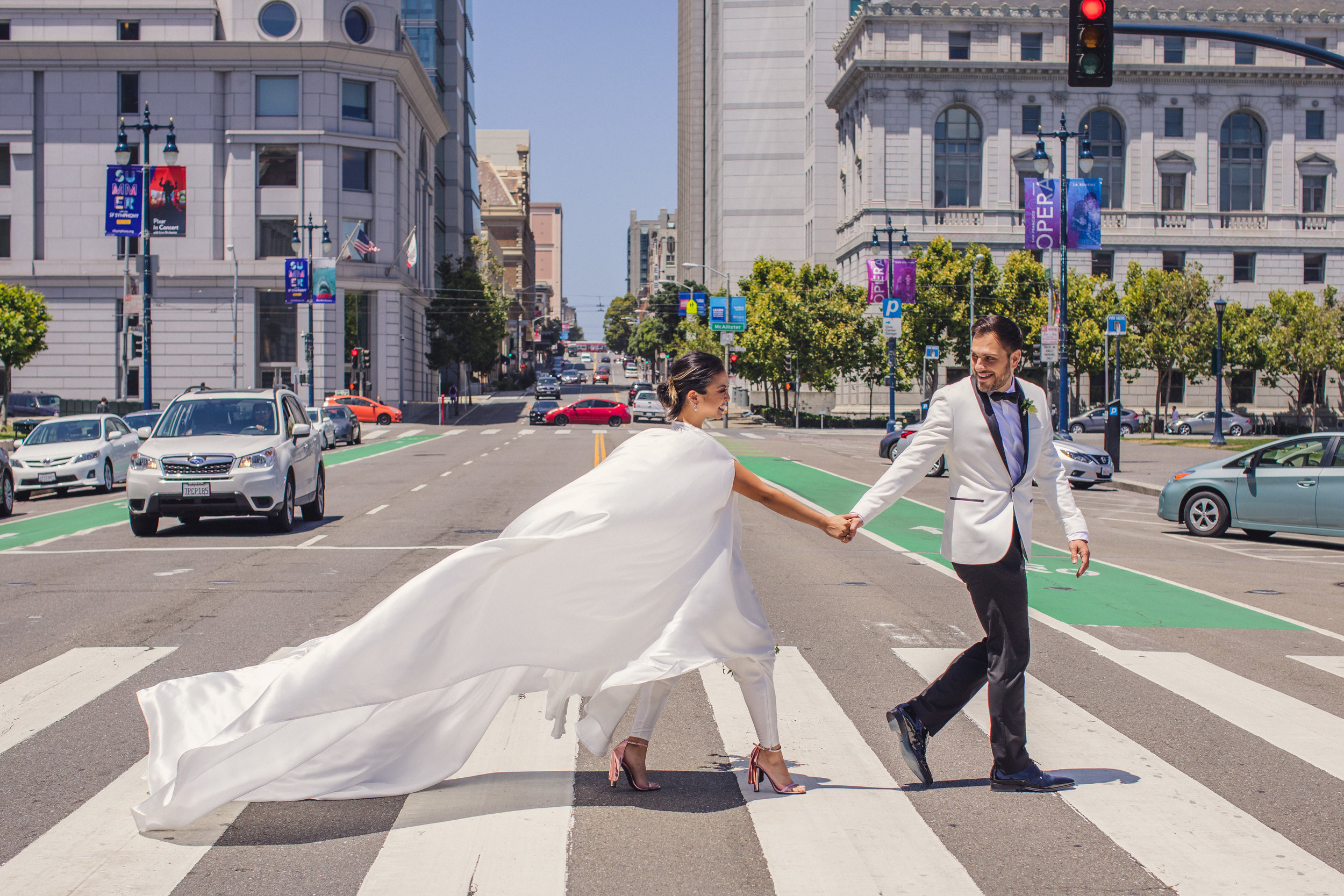 Location: City Hall, San Francisco, CAThis bride was inspired by samurai culture when she had this caped jumpsuit designed for her. It was epic. I considered bringing a wind machine just to follow her around with all day.
